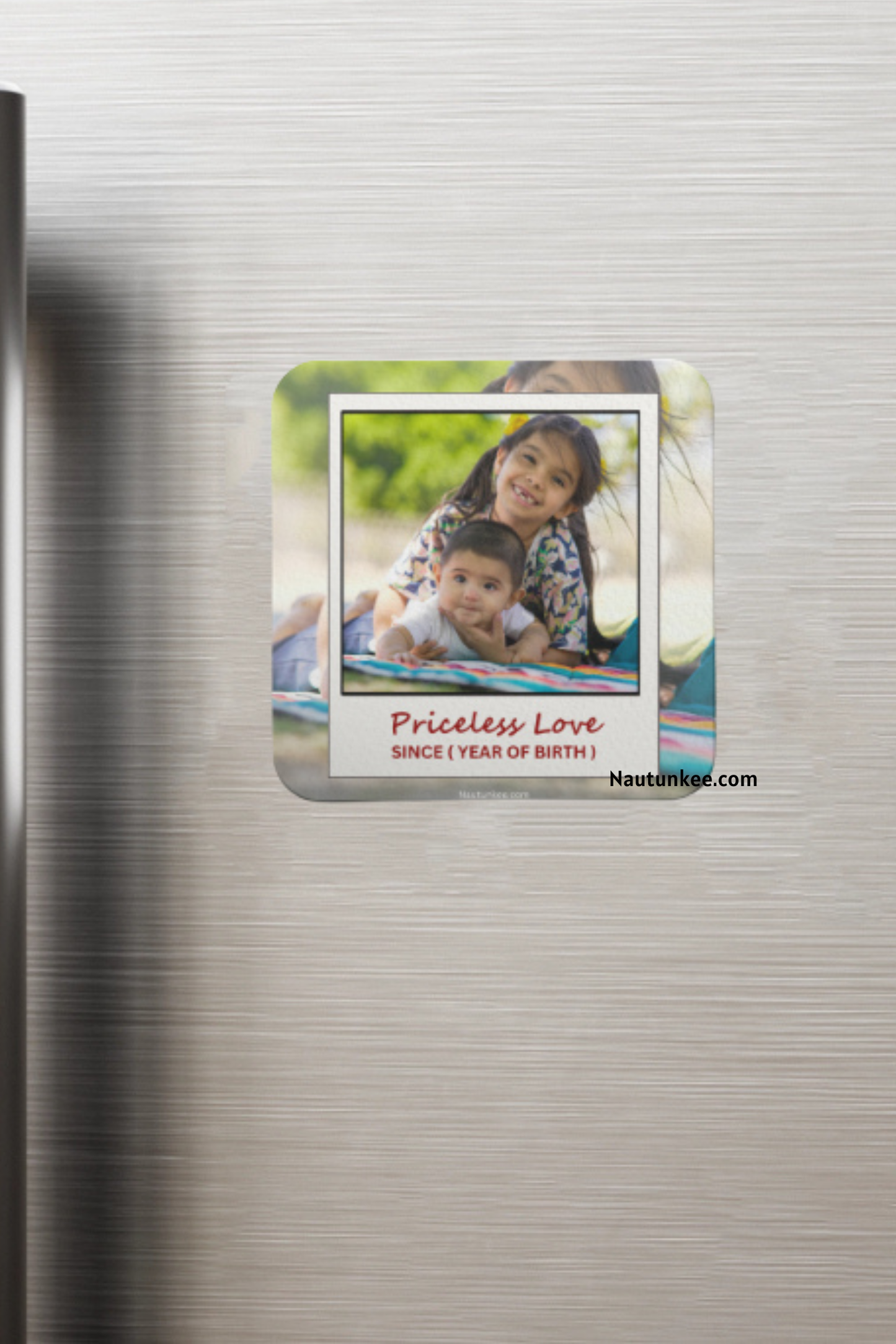 A custom photo magnet of siblings with rounded corners displayed on a brushed stainless steel refrigerator door. The magnet features a printed photo of a sister and brother with the text 'Priceless Love'.