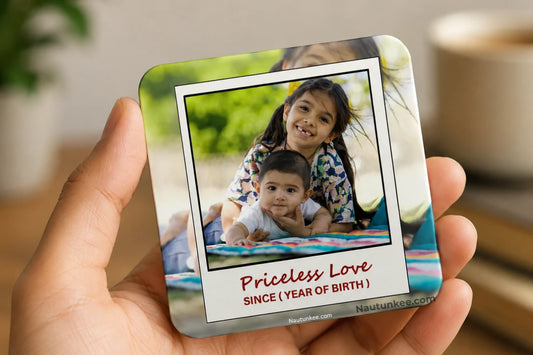 A customised rakhi gift with photos of siblings. The magnet features a printed photo of a sister and brother with the text 'Priceless Love' and the year of birth of the younger sibling.