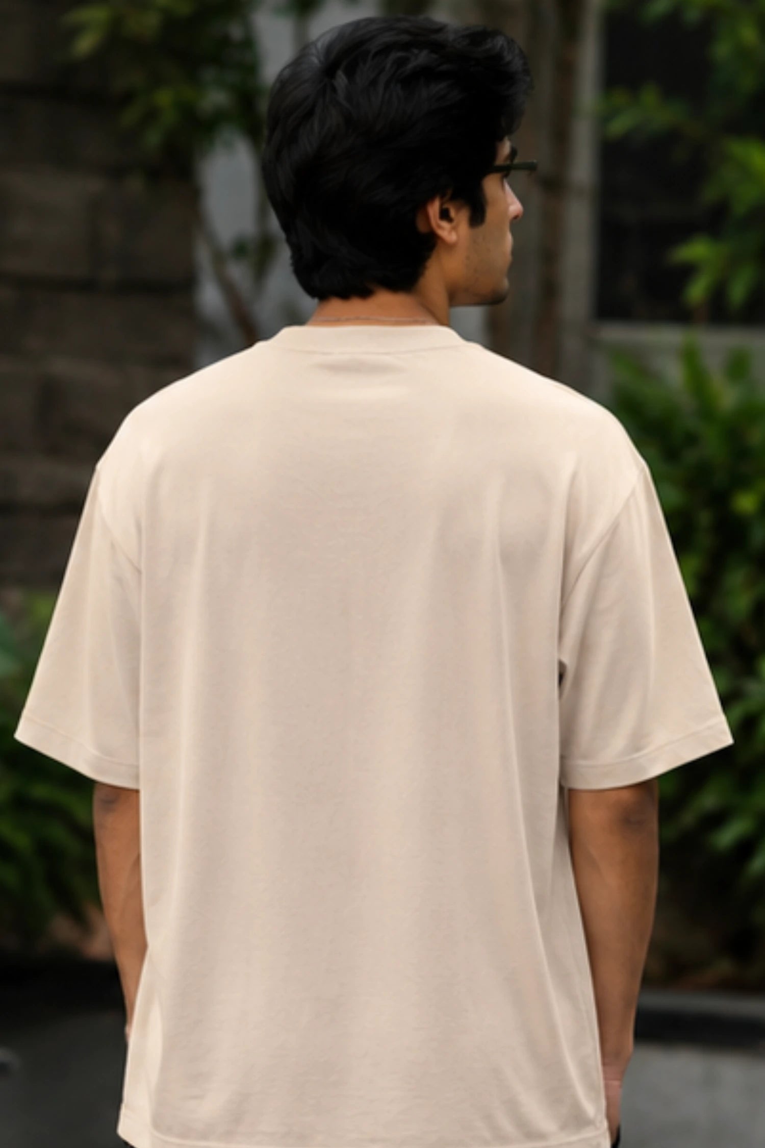 Model wearing Beige Oversized French Terry T-Shirt back view